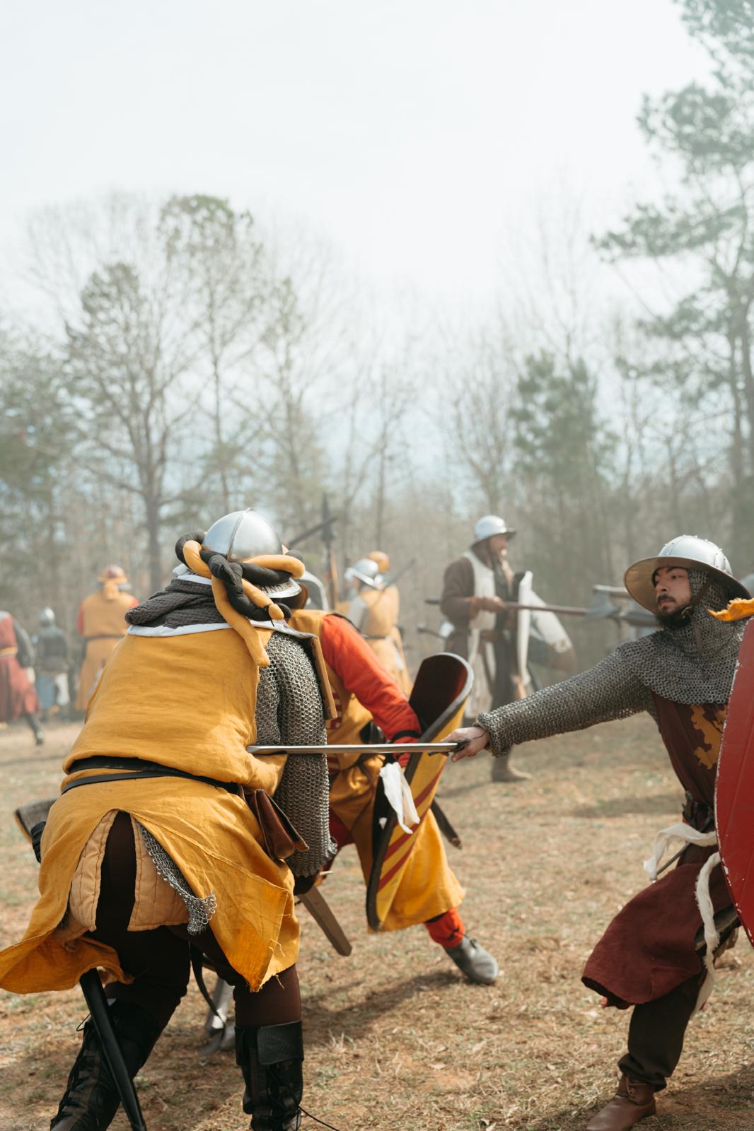 Ludwig, an early 13th-century Flemish mercenary, attacking a soldier dressed in yellow with his sword